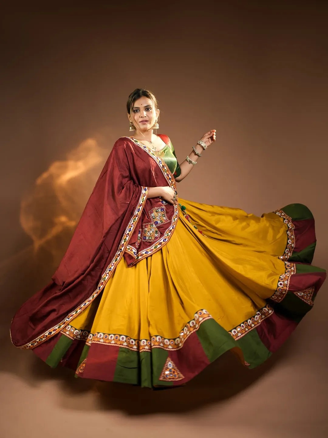 Rajmayuri Mustard Maroon Kutchi Mirror Work Festive Lehenga Set